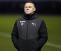 Rooney ends playing career to become Derby manager