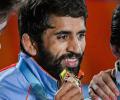 Bajrang Punia defends title, Sakshi reverses losing trend to earn maiden CWG gold