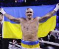 Usyk beats Joshua on split decision to retain heavyweight titles