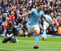 EPL PIX: Arsenal send title warning; City crush Liverpool