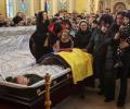 Hundreds mourns champion kickboxer killed fighting Russian troops