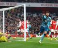 PICS: Arsenal stage late escape, but title hopes hit