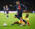 Mbappe powers PSG to win; Barcelona survive scare