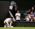 Wimbledon: Djokovic wipes slippery centre court