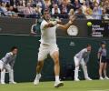 Wimbledon: Alcaraz, Rybakina advance as rain plays havoc