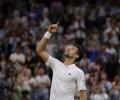 Djokovic survives Wawrinka's late surge