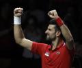 Djokovic sends Serbia into Davis Cup semi against Italy