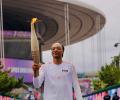 PIX: Snoop Dogg carries Olympic Torch!