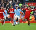 Soccer PIX: Liverpool salvage point against City; Spurs hammer Aston Villa