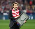 World Cup star Forlan takes up tennis racket