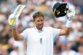 PIX: Root's century powers England to huge lead