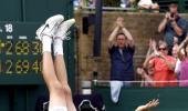 Record king Isner upstages Queen at Wimbledon