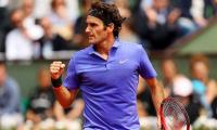 New racquet-wielding Federer says never felt better before Wimbledon