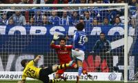 Dortmund twice squander lead in draw at Schalke