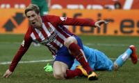 Torres reaches century, Atletico keep pressure on Barca