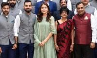 Controversy after Anushka poses with Team India