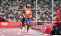 Athletics: Hassan kicks off treble bid with 5,000m gold