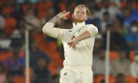 Stokes applies saliva; fan tries to enter field