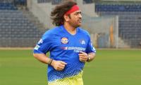 Dhoni Unveils Retro Look: Back to Long Hair, Bandanas