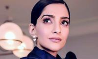 Pix: Sonam flirts with purple and red at Cannes!