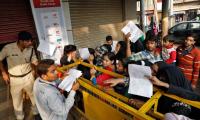 On Day 3, people 'endlessly wait' outside banks and ATMs for cash