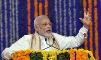 PM warns of 'surgical strikes' against black money