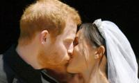 Sealed with a kiss! Harry and Meghan are husband and wife