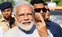 PM Modi votes, says 'voter ID' more powerful than IED