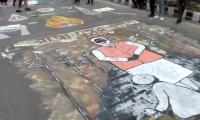 PIX: Jamia students paint road with anti-CAA graffiti