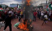 Netanyahu in Congress, protestors burn US flag outside