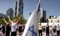 Amid war, hundreds join Yoga Day events in Israel