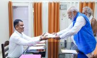 Allies by his side, Modi files nomination; no Nitish