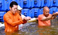 Bhutan's King Takes Dip In Sangam