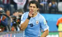 After biting ban...Suarez returns to Uruguay