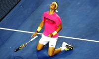 Nadal survives cramps to battle into third round