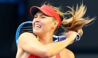 Sharp Sharapova returns to form to reach fourth round