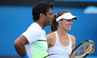 Wimbledon: Paes-Hingis through to semi-finals, Sania crashes out