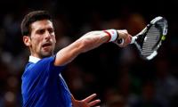 Record-chasing Djokovic sets up Murray showdown