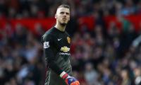 Soccer shots: De Gea signs new four-year United contract