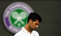 Saved by the rain, Djokovic's hopes hanging by a thread at Wimbledon