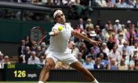 Wimbledon PIX: Federer, Serena in quarters, injured Nishikori retires