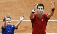 Djokovic, Serena face overtime in Paris