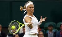 PHOTOS: Kuznetsova dumps out Wozniacki, Serena and Murray advance