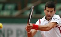 French Open PIX: Djoko back on top before rain stops play, Radwanska exits