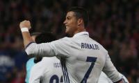 La Liga: Ronaldo treble sinks Atletico, Barcelona held