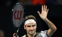 PHOTOS: Federer makes winning return at Australian Open