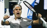 PHOTOS: Resilient Federer holds off Nishikori to reach quarter-finals