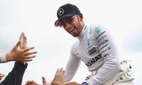 Hamilton marks 200th race with victory in Belgium