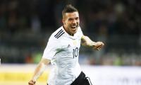 Friendly: Podolski bids goodbye with stunning winner over England