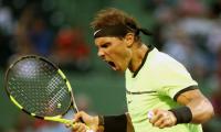 PHOTOS: Nadal wins in 1000th match, Raonic withdraws